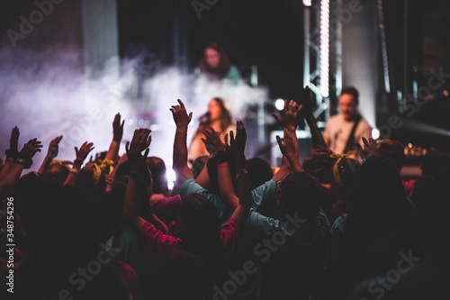 crowd of people dancing at concert