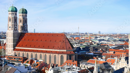 The Frauenkirche(Frauenkirche).Cathedral of the blessed virgin Mary against the urban landscape,the highest Church in Munich with red tiles,next to the main square of the city of Marienplatz.Template.