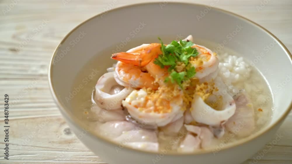 porridge or boiled rice soup with seafood (shrimps, squid and fish) bowl porridge or boiled rice soup with seafood (shrimps, squid and fish) bowl