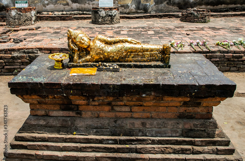 lying buddha in Wat Lokkayasutharam (Phra Buddha Sai Yat), a Buddhist temple of archaeological park, Ayutthaya, Thailand photo