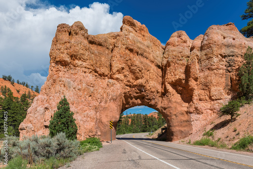 Scenic road with red Arch in Red canyon to Bryce Canyon National Park, Utah