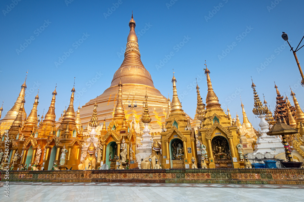 Myanmar, Yangon, elements of Golden Pagoda The Shwedagon against the blue sky . Shwedagon Pagoda is the most sacred Buddhist pagoda in Myanmar Myanmar, Yangon, elements of Golden Pagoda The Shwedagon against the blue sky . Shwedagon Pagoda is the most sacred Buddhist pagoda in Myanmar