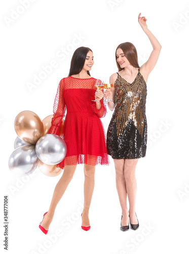 Happy young women with glas...