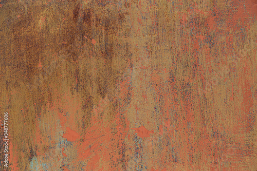 Rusty metal background with old peeled paint on it.