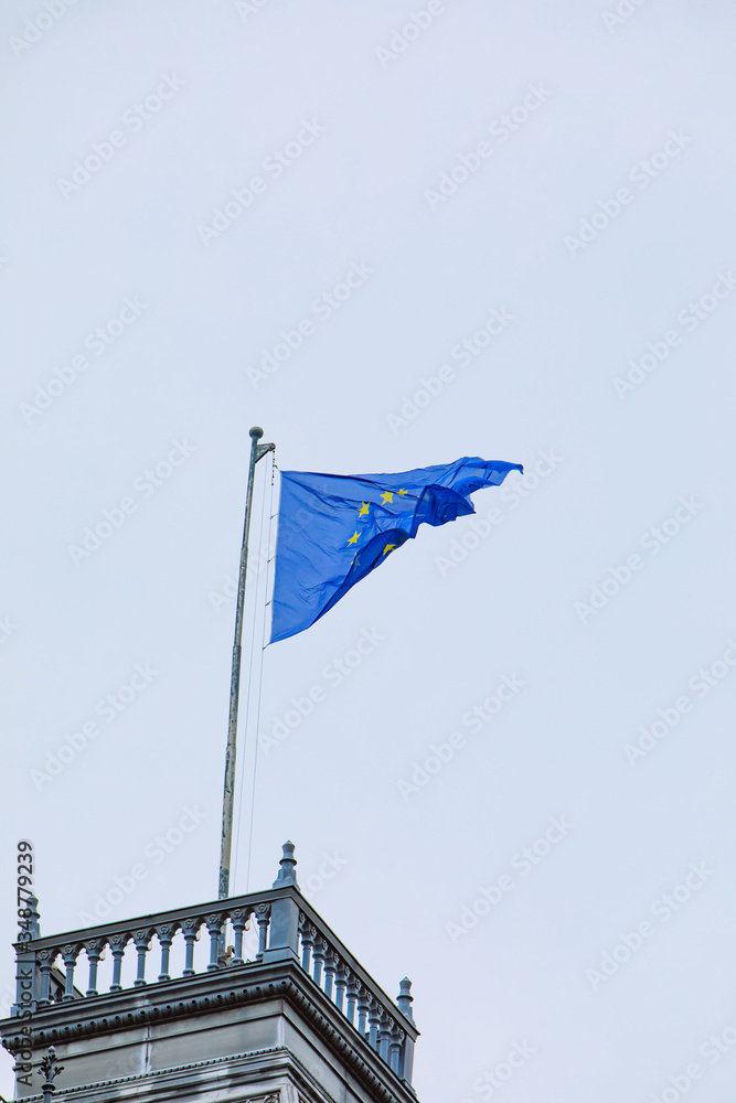 european union flag in front of blue sky