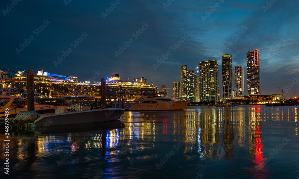 Cruise ship and Miami Skyline. Miami, Florida, USA skyline on Biscayne Bay.