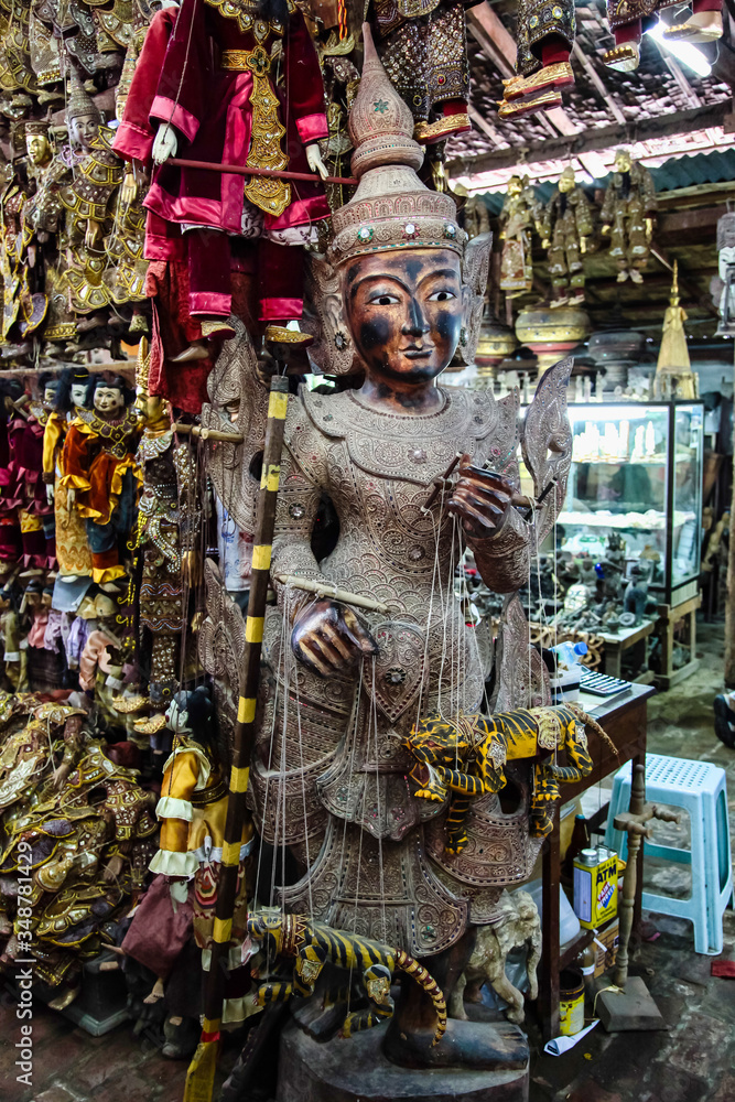 Traditional handicraft puppets are sold in a market at Mandalay, Myanmar.
