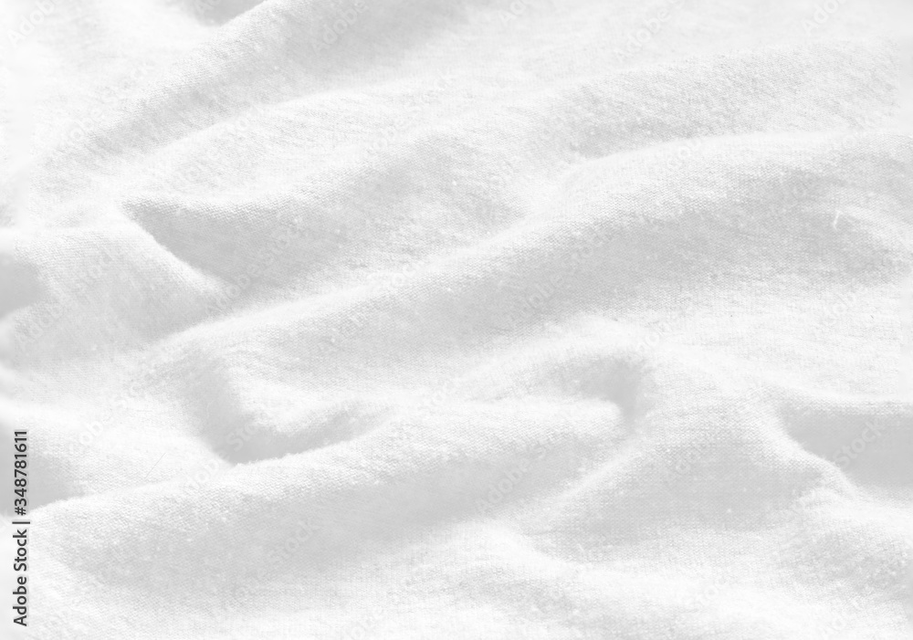 Soft focus white fabric texture for background.