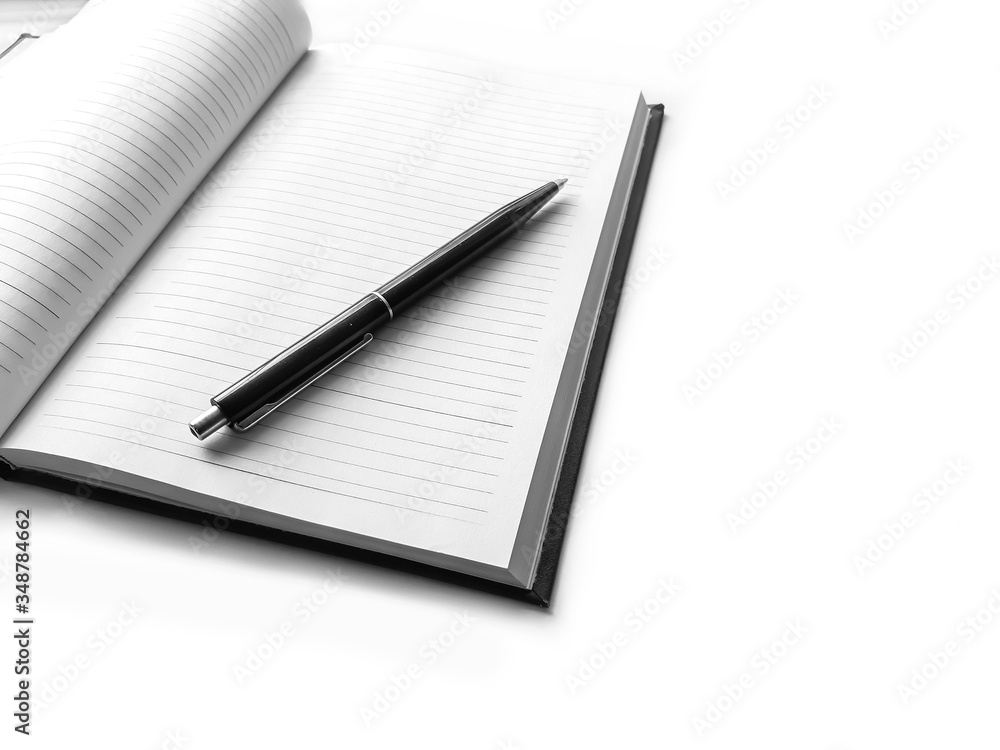 Notebook, empty diary and pen, isolated on white desk Notebook, empty diary and pen, isolated on white desk