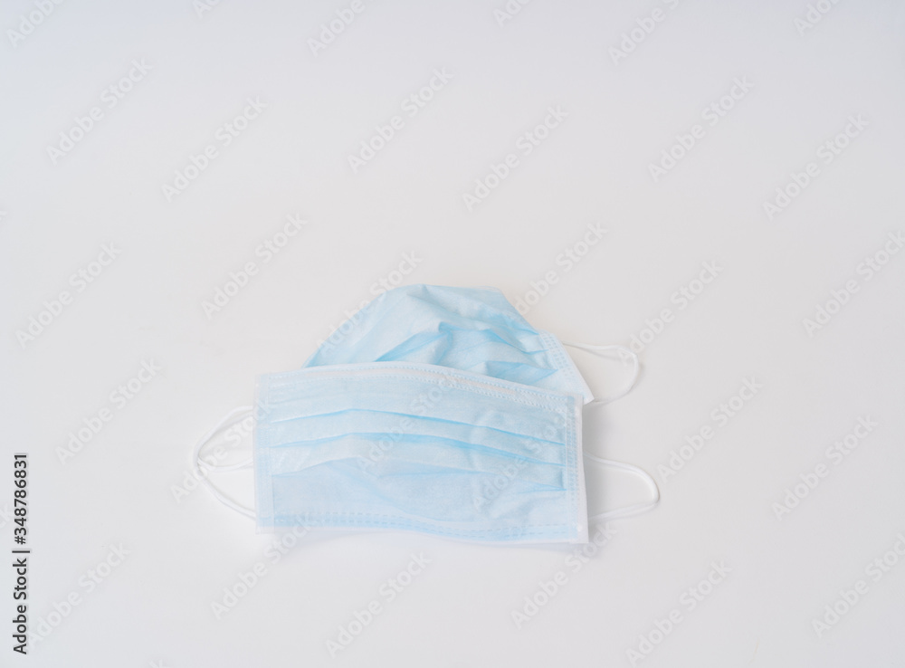 Surgical face mask and alcohol gel protect yourself from COVID-19. Medical concept Surgical face mask and alcohol gel protect yourself from COVID-19. Medical concept
