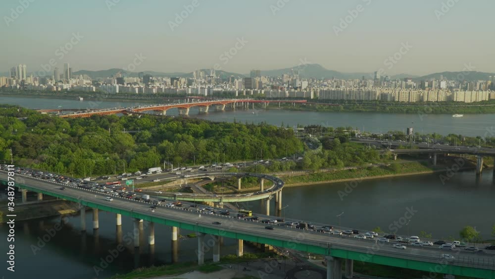 Seoul city car Traffic on Yongbigyo and Seoungsudaegyo bridges from Eungbongsan Mountain, South Korea on sunset Seoul city car Traffic on Yongbigyo and Seoungsudaegyo bridges from Eungbongsan Mountain, South Korea on sunset