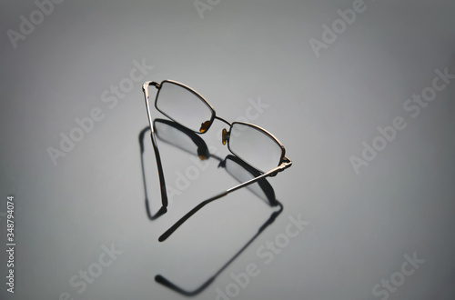 Glasses for visual acuity on the table.