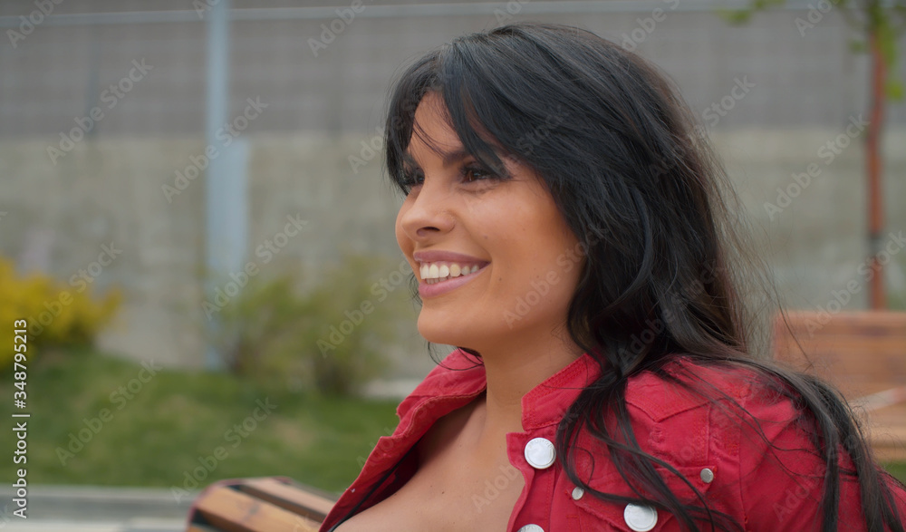 Smiling woman sitting on the bench Smiling woman sitting on the bench