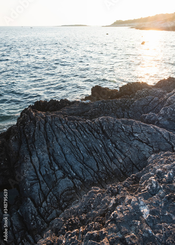 The beatiful coast of Premantura at sunset, kamenjak, Croatia photo