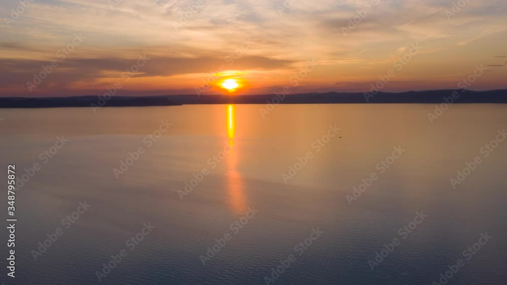 Sunset Hyperlapse from the lake Balaton in Hungary
Drone moves slowly forward Sunset Hyperlapse from the lake Balaton in Hungary
Drone moves slowly forward