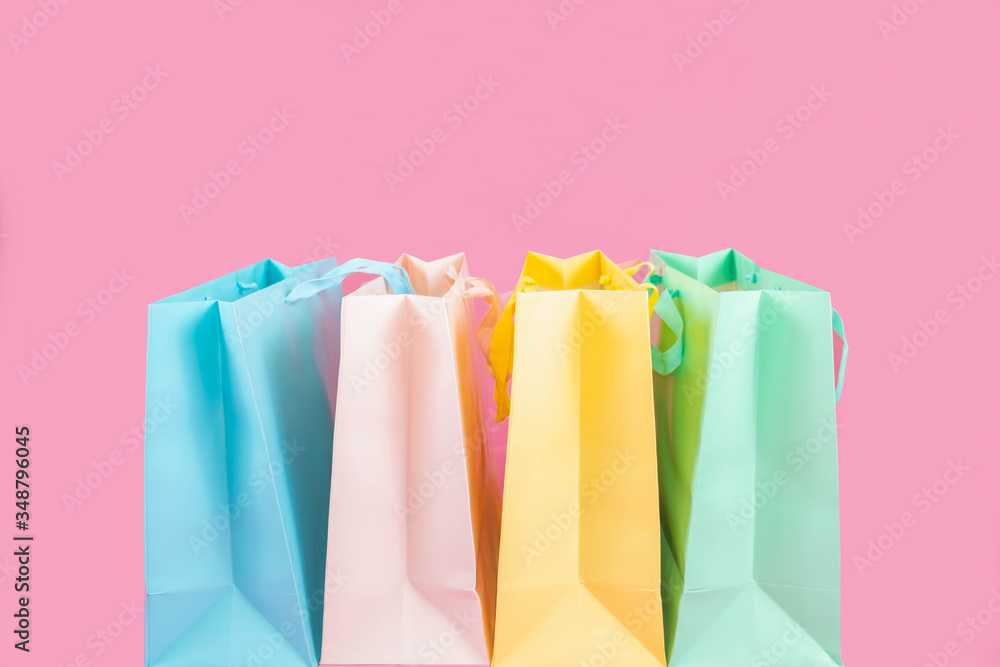 colorful shopping bag isolated on pink background