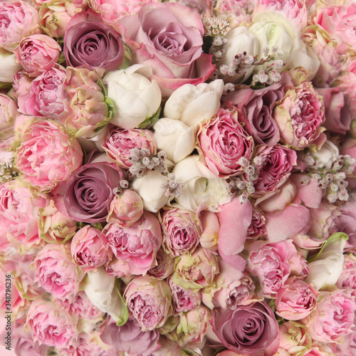 wedding bouquet with rose bush, Ranunculus asiaticus as a background