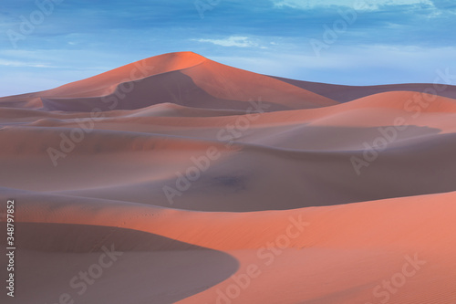 Sunset over the sand dunes in the desert  California USA Discovery and adventure travel concept. Sunlight over the desert dunes.
