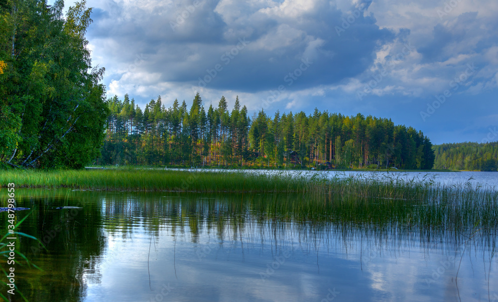 Fototapeta premium Forest reflection on a lake in Finland