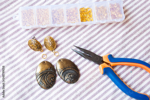 Assembly of indian style earrings. Handmade gold jewelry.