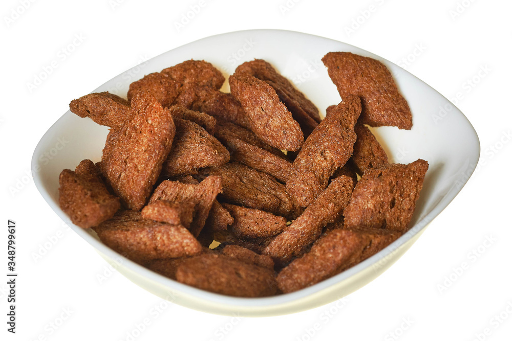 Full bowl of spicy hard chuck from brown bread isolated on white background Full bowl of spicy hard chuck from brown bread isolated on white background