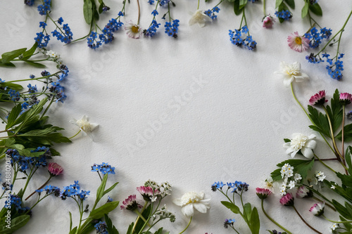 Spring flowers flat lay on the white background 