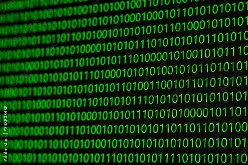 Binary numbers, zeros and ones, in green on a black computer monitor Binary numbers, zeros and ones, in green on a black computer monitor