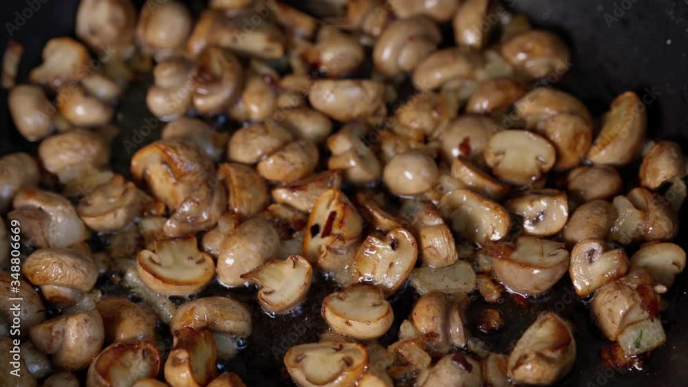 Fried mushrooms with onions in a pan Fried mushrooms with onions in a pan