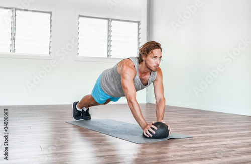 Home gym medicine ball workout abs exercise stability body exercises man training tricep pushups.