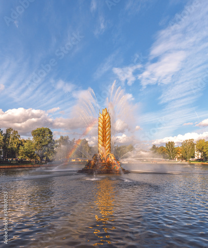 The restored fountain "Kolos" (Golden Spike) at VDNH. Rainbow in a fountain