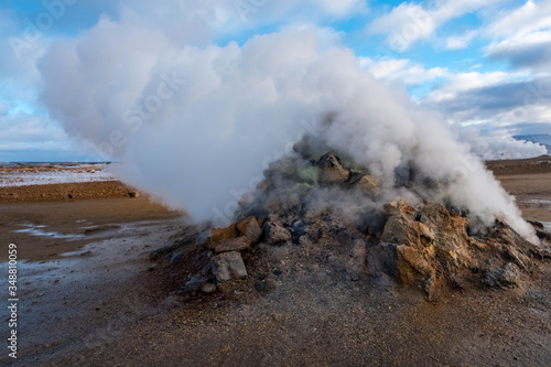 Fototapeta Water vapor coming out of the chimneys of Hverir in Iceland