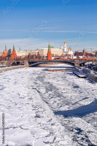 Classic view of the Moscow Kremlin. View from the Patriarchal bridge. Moscow river in ice.