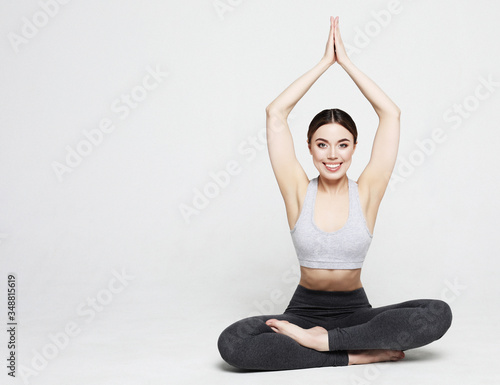 Fototapeta Naklejka Na Ścianę i Meble -  sport, yoga and people concept - lovely young woman doing yoga, sports exercises for relaxation and meditation