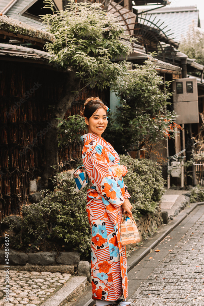 Asian beautiful woman dressing kimono and sightseeing around japanese old house in Kyoto, Japan Asian beautiful woman dressing kimono and sightseeing around japanese old house in Kyoto, Japan