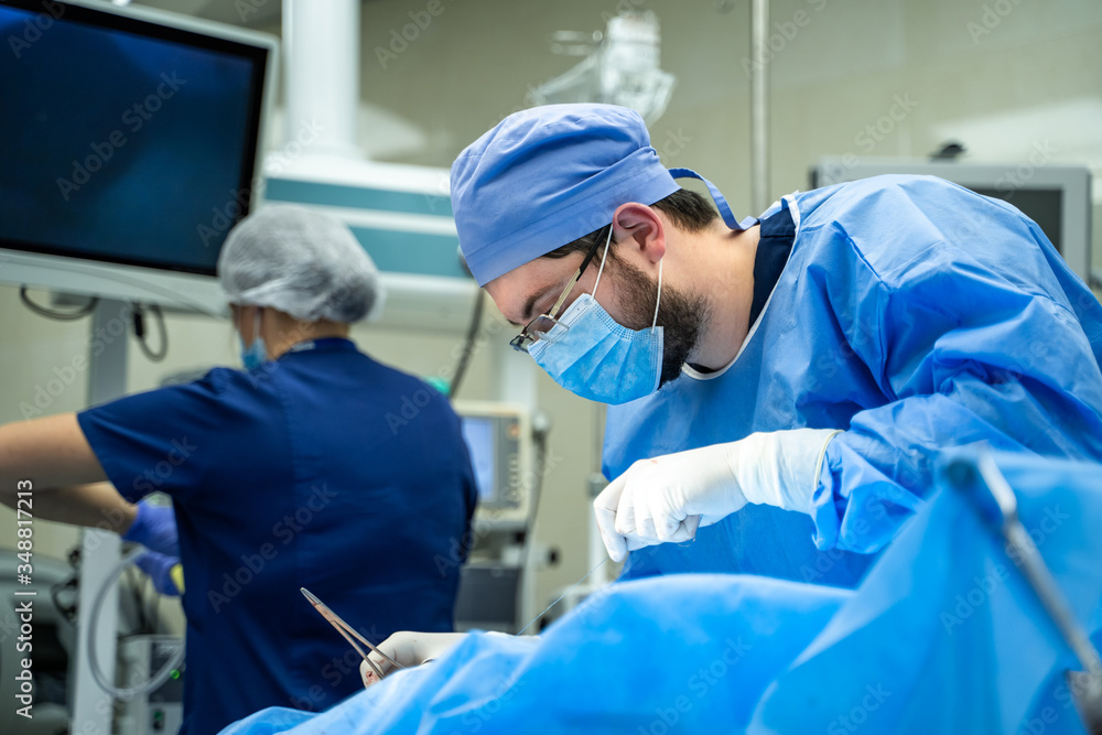 Team surgeon at work in operating room. Modern equipment in operating room. Medical devices for neurosurgery. Team surgeon at work in operating room. Modern equipment in operating room. Medical devices for neurosurgery.