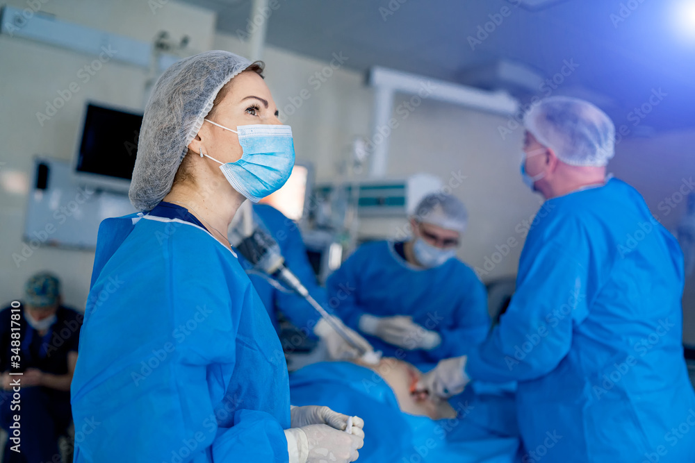 Robotic assisted minimally invasive surgery with surgical robot. Robotic surgical system in hospitals concept Robotic assisted minimally invasive surgery with surgical robot. Robotic surgical system in hospitals concept