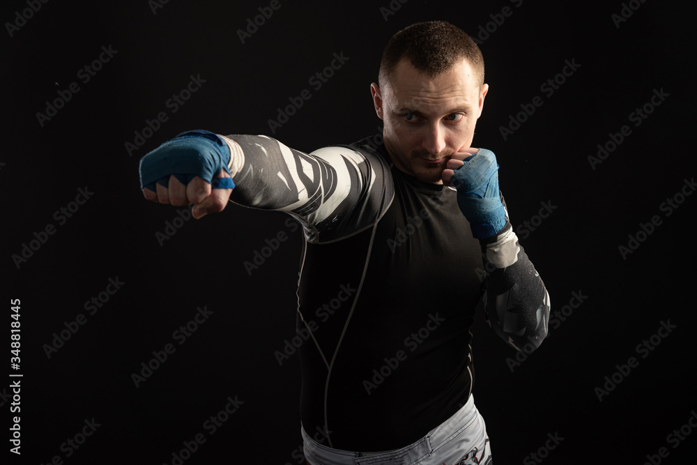 Mixed Martial Arts Fighter Against Dark Background