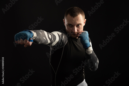Mixed Martial Arts Fighter Against Dark Background © Siarhei Kulikou