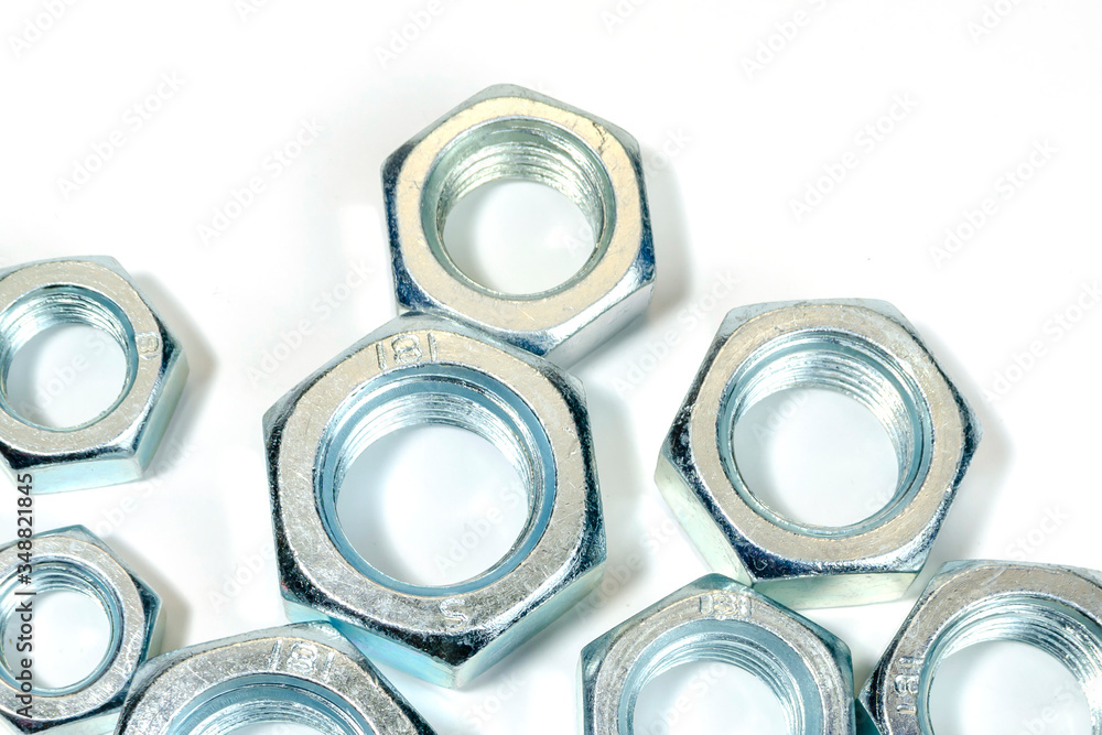 group of new, shiny big nuts on white. group of new, shiny big nuts on white.