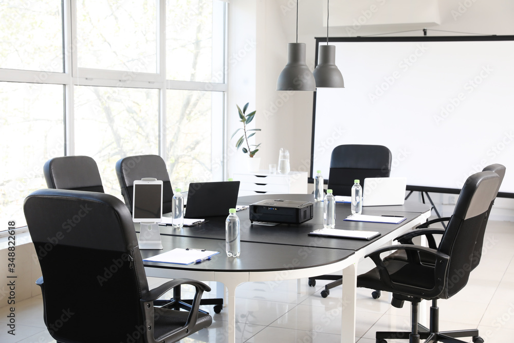 Table prepared for business meeting in office Table prepared for business meeting in office