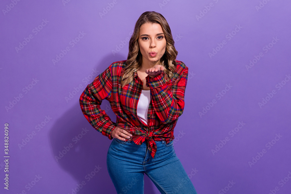 Portrait of her she nice attractive lovely pretty cute flirty cheerful girl wearing checked shirt sending air kiss isolated over bright vivid shine vibrant lilac violet purple color background Portrait of her she nice attractive lovely pretty cute flirty cheerful girl wearing checked shirt sending air kiss isolated over bright vivid shine vibrant lilac violet purple color background