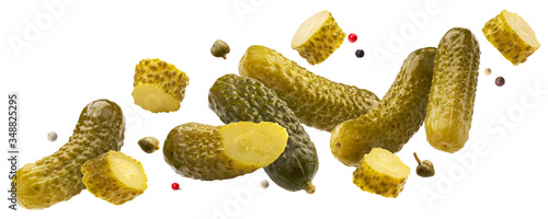 Pickled gherkins, marinated cucumbers isolated on white background photo