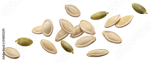Falling pumpkin seeds isolated on white background