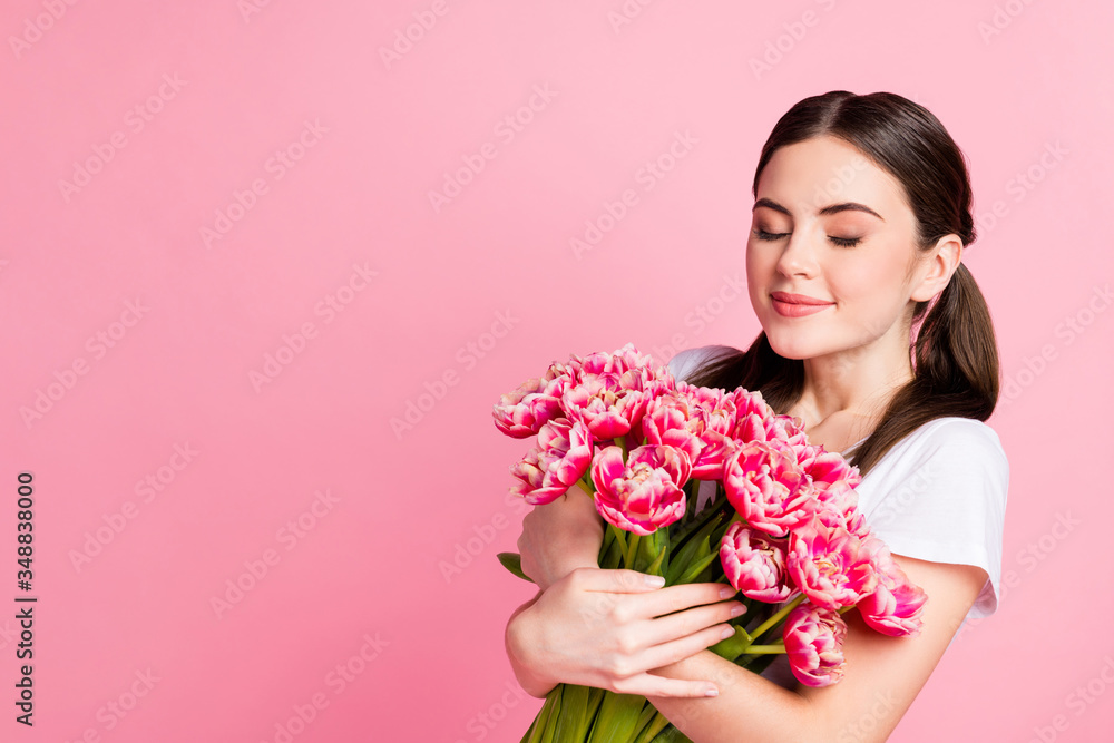 Close-up portrait of her she nice-looking attractive lovely pretty charming dreamy cheery girl holding in hands bunch festal flowers smelling enjoying isolated over pink pastel color background Close-up portrait of her she nice-looking attractive lovely pretty charming dreamy cheery girl holding in hands bunch festal flowers smelling enjoying isolated over pink pastel color background