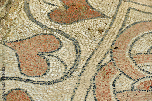 Detail of ancient mosaic floor with heart leaves used in Greece or Roman culture