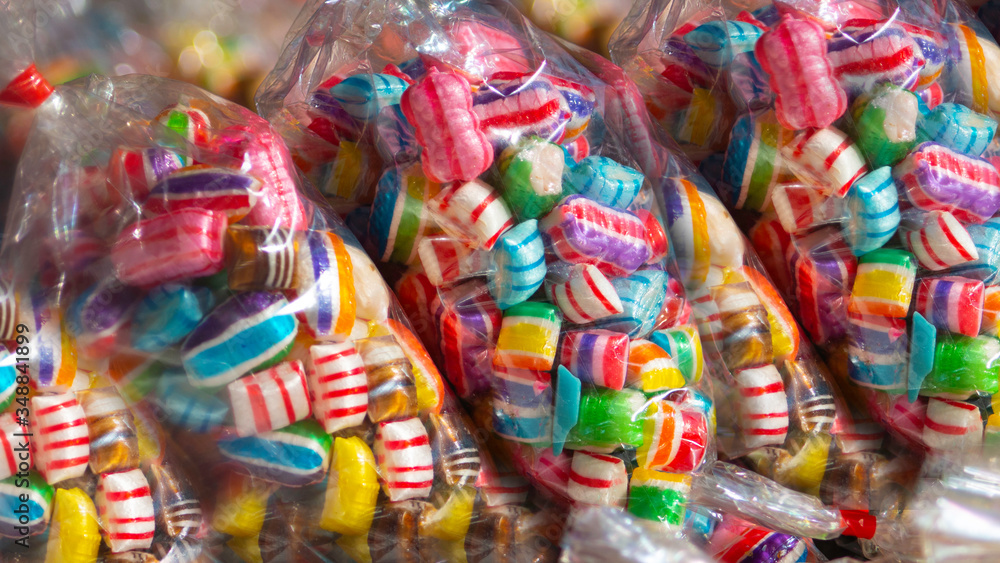 Colorful candies in plastic packaging.