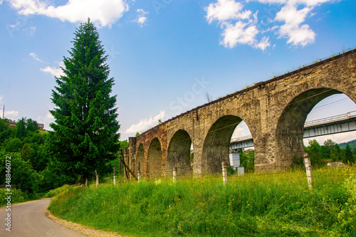 Historical abandoned railway arch bridge viaduct in Vorokhta, Ivano-Frankivsk Region, Ukraine © haidamac