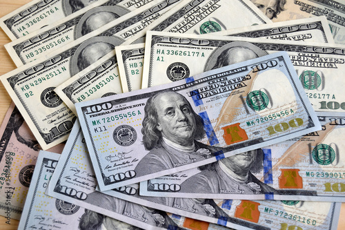 Wallpaper Mural Money are on the table. American dollars  banknotes. Each banknote a hundred dollars. Cash currency. Torontodigital.ca