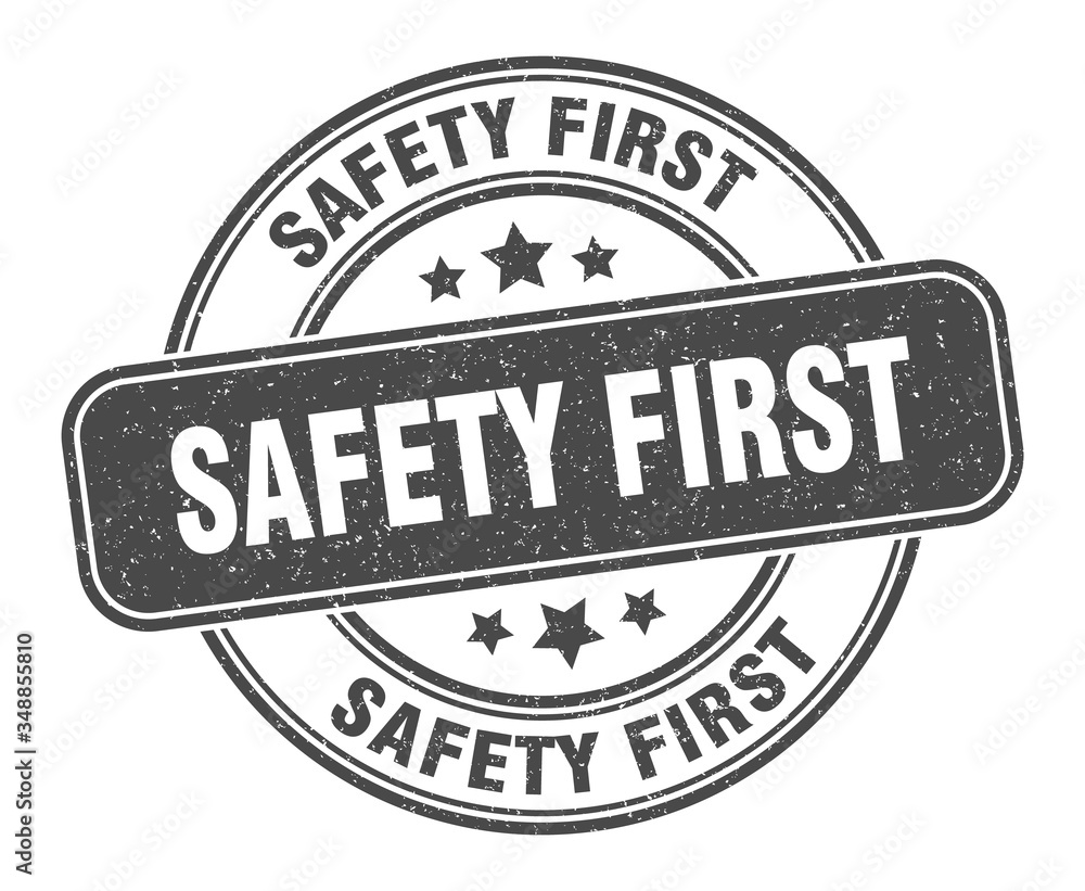 safety first stamp. safety first label. round grunge sign safety first stamp. safety first label. round grunge sign