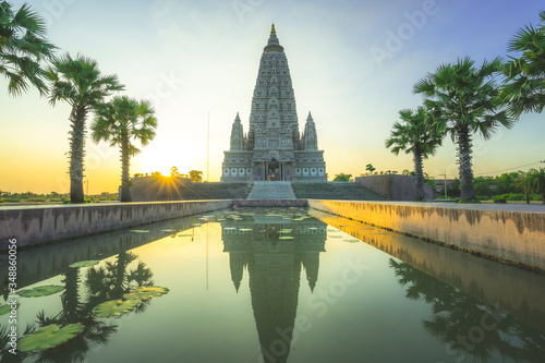 Reflection on water of Panya Nantharam Temple at Thailand at sunset
